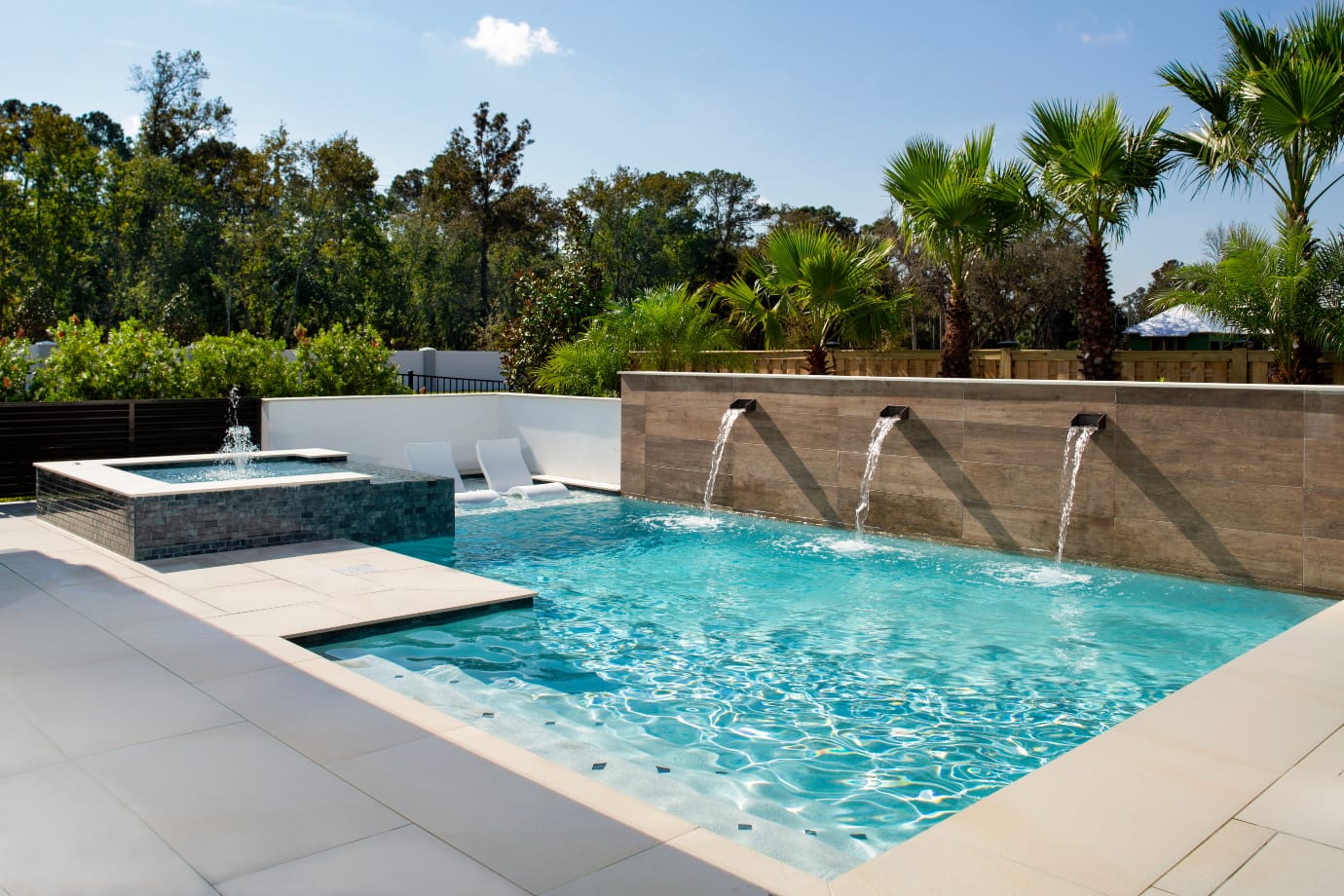 pool with three fountains on side