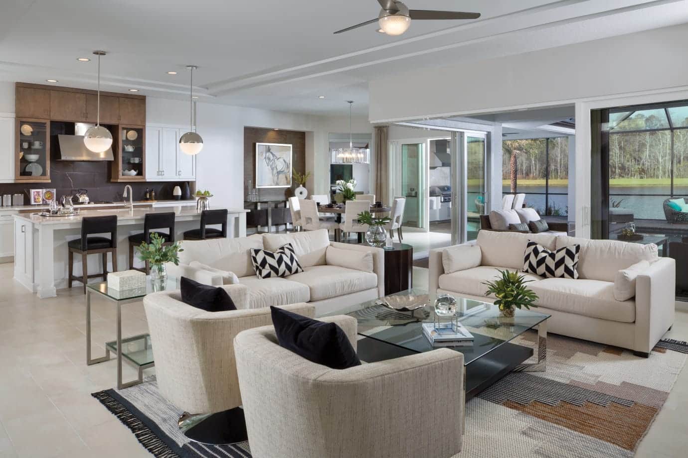 great room couch and chairs with kitchen island